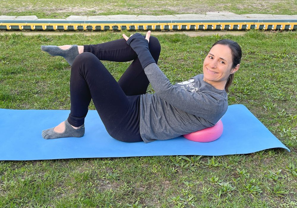 Woman doing Pilates exercise on the mat